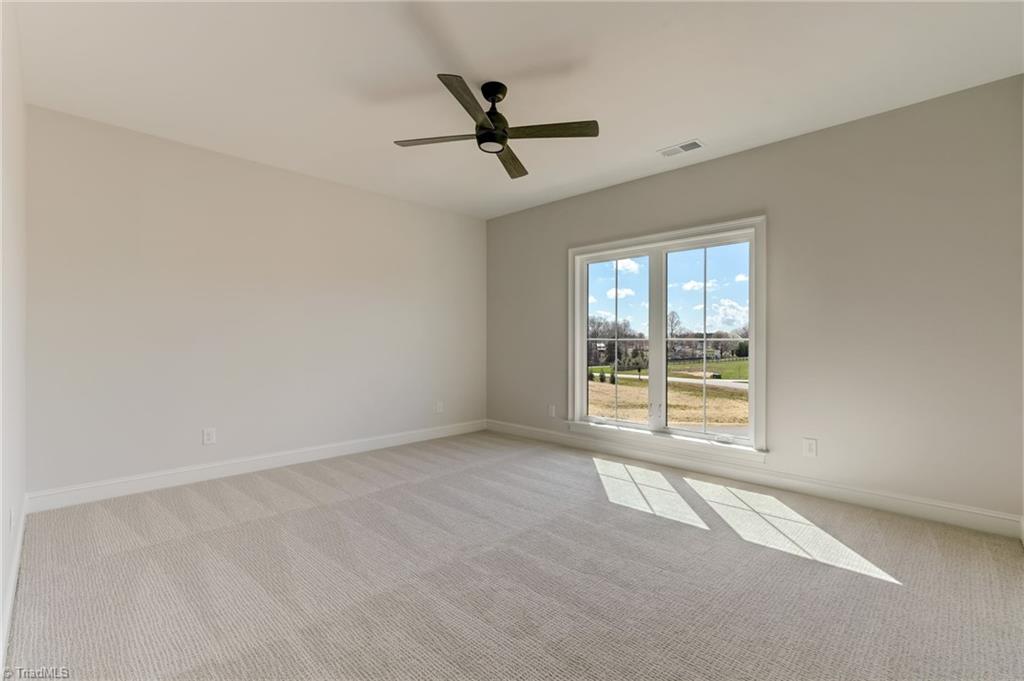 7688 Kyran Court Oak Ridge, NC 27310 - Photo 29 of 36 4th bedroom with en suite bath could serve as a upstairs primary option