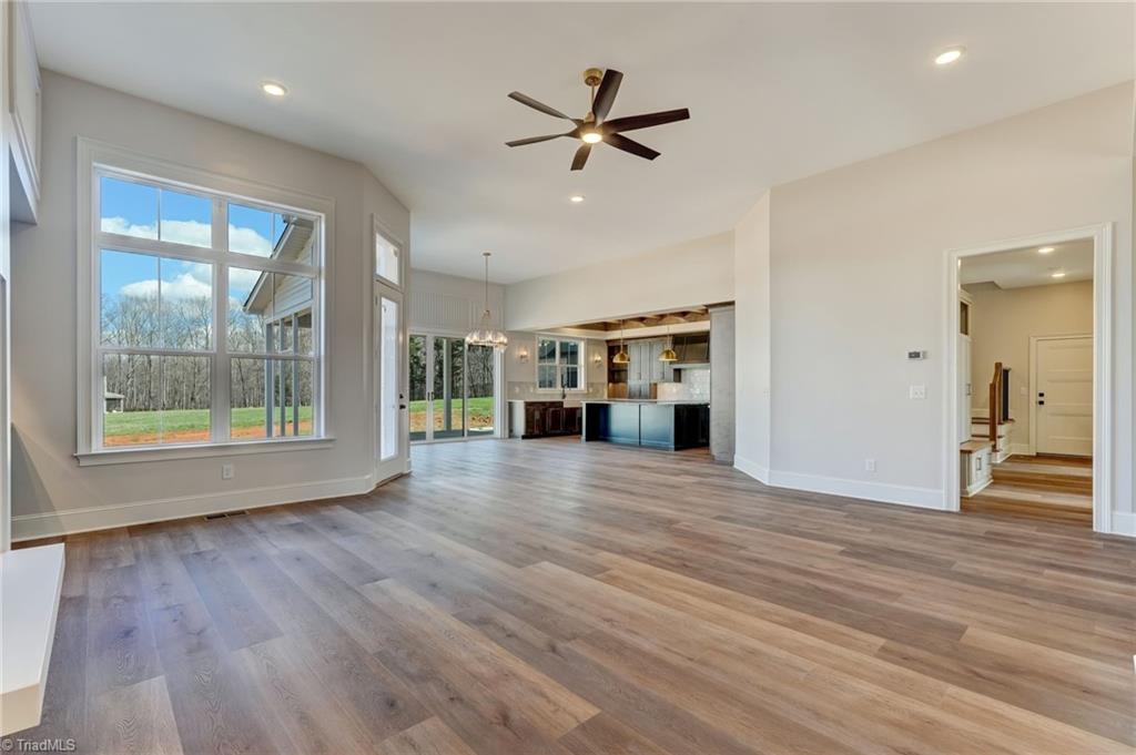 7688 Kyran Court Oak Ridge, NC 27310 - Photo 4 of 36 Great room with 12 ft ceilings and abundant natural light