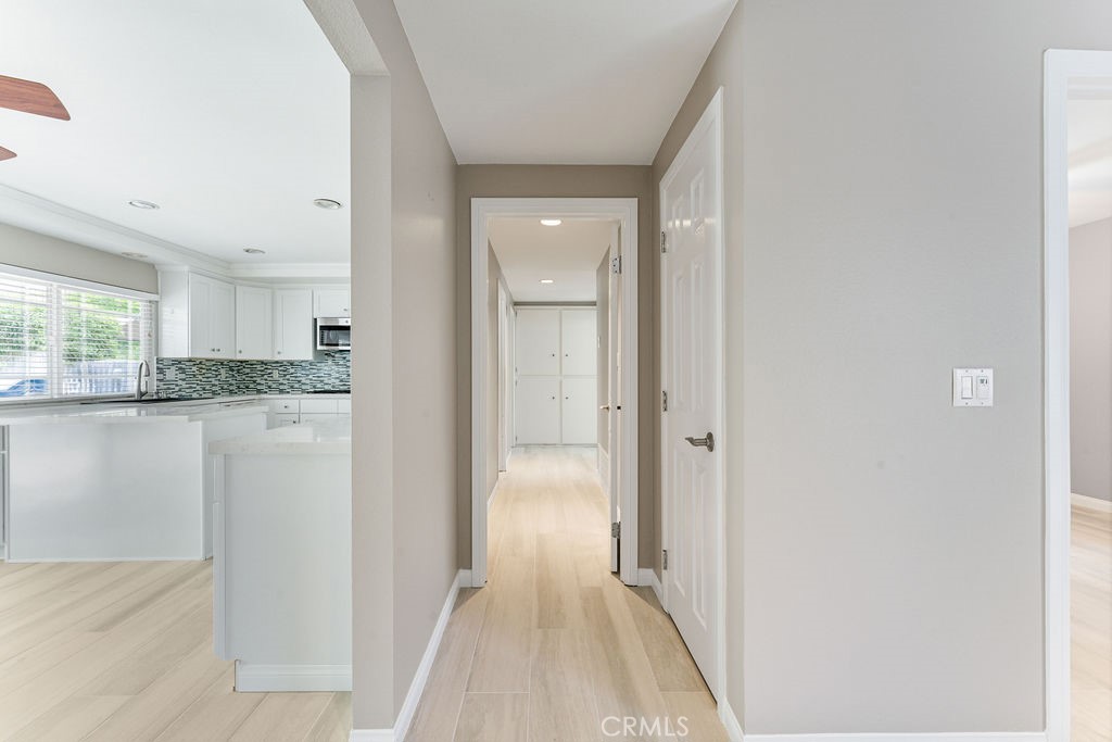 25352 Hugo Road Laguna Niguel, CA 92677 - Photo 13 of 31 Hallway to other bedrooms. Note that the flooring is tile and it is a gray beige color. The beige color comes in brighter than the gray tone.