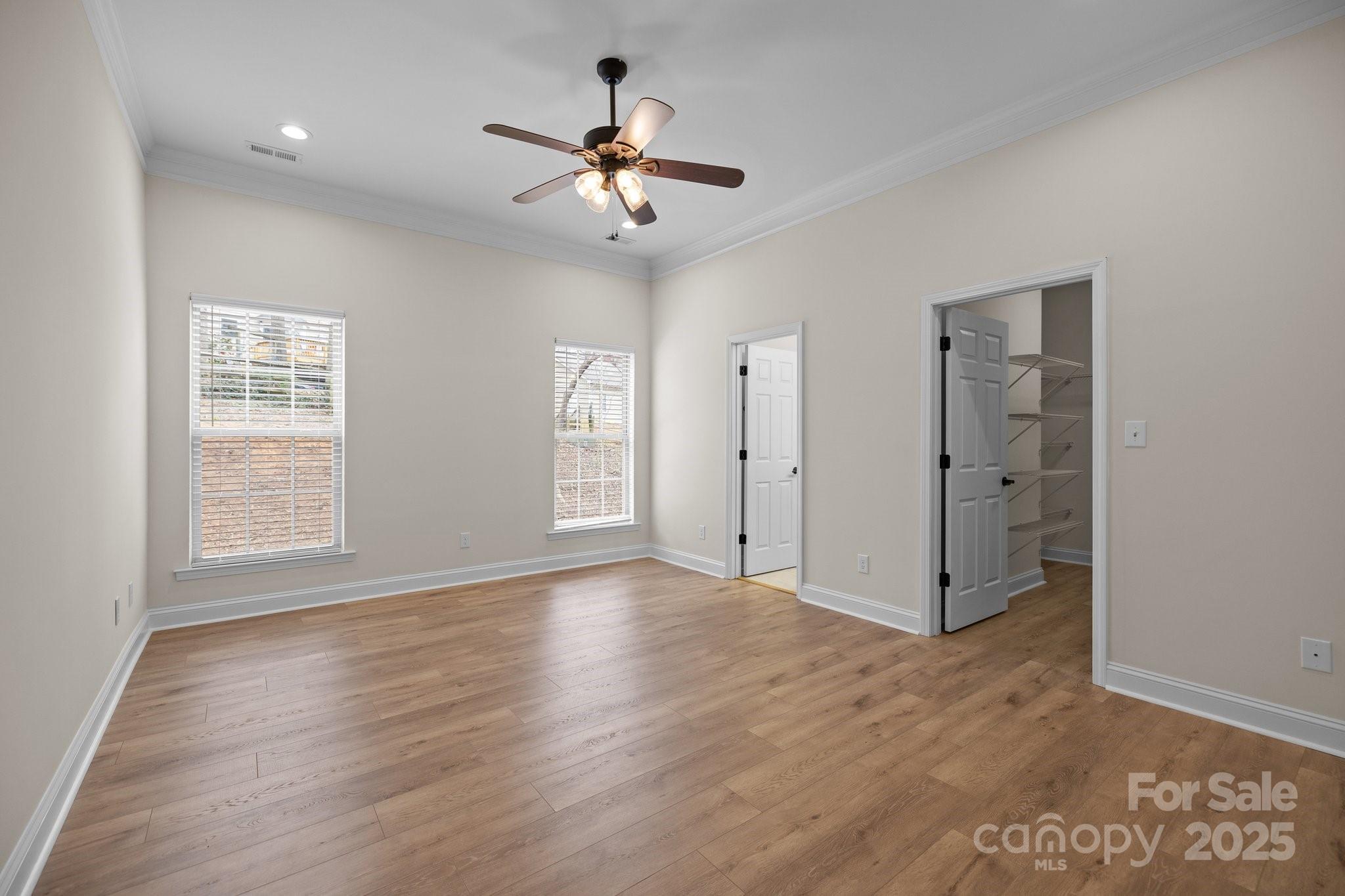 910 Pine Knoll Road, Unit 13 Fort Mill, SC 29715 - Photo 16 of 37 a view of an empty room with wooden floor and a window