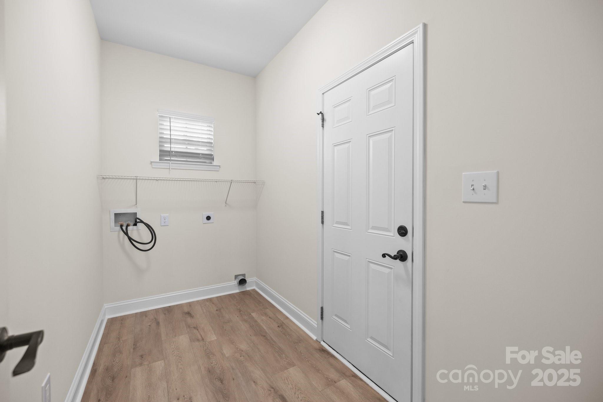 910 Pine Knoll Road, Unit 13 Fort Mill, SC 29715 - Photo 20 of 37 a view of a livingroom with wooden floor and a window