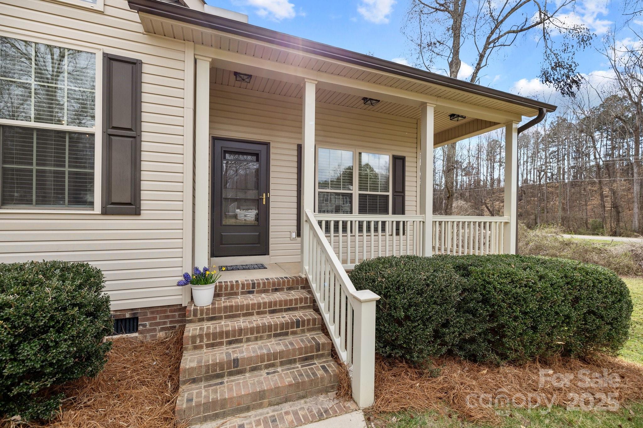 910 Pine Knoll Road, Unit 13 Fort Mill, SC 29715 - Photo 31 of 37 a front view of a house with a yard