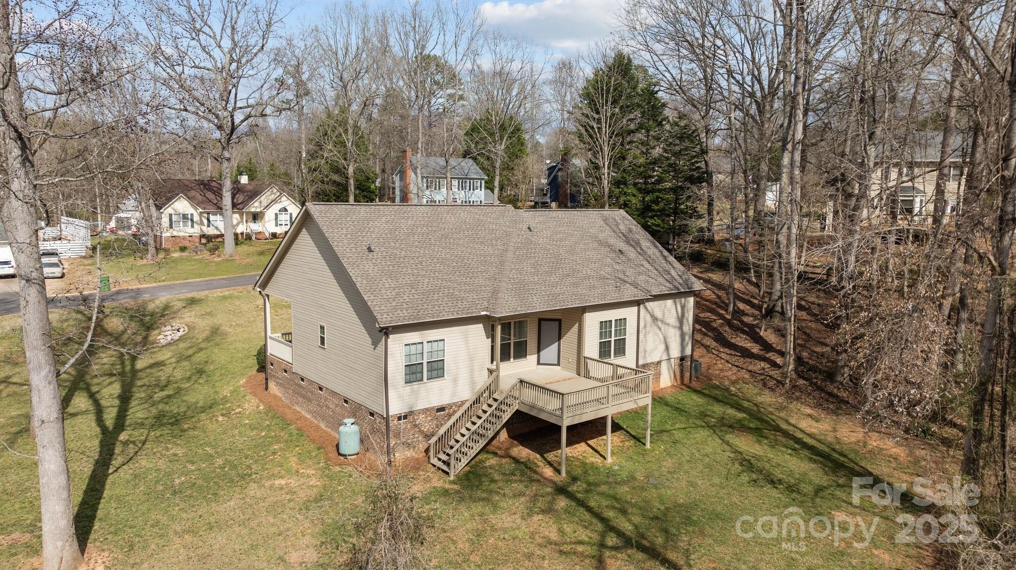 910 Pine Knoll Road, Unit 13 Fort Mill, SC 29715 - Photo 34 of 37 a roof deck with table and chairs under an umbrella