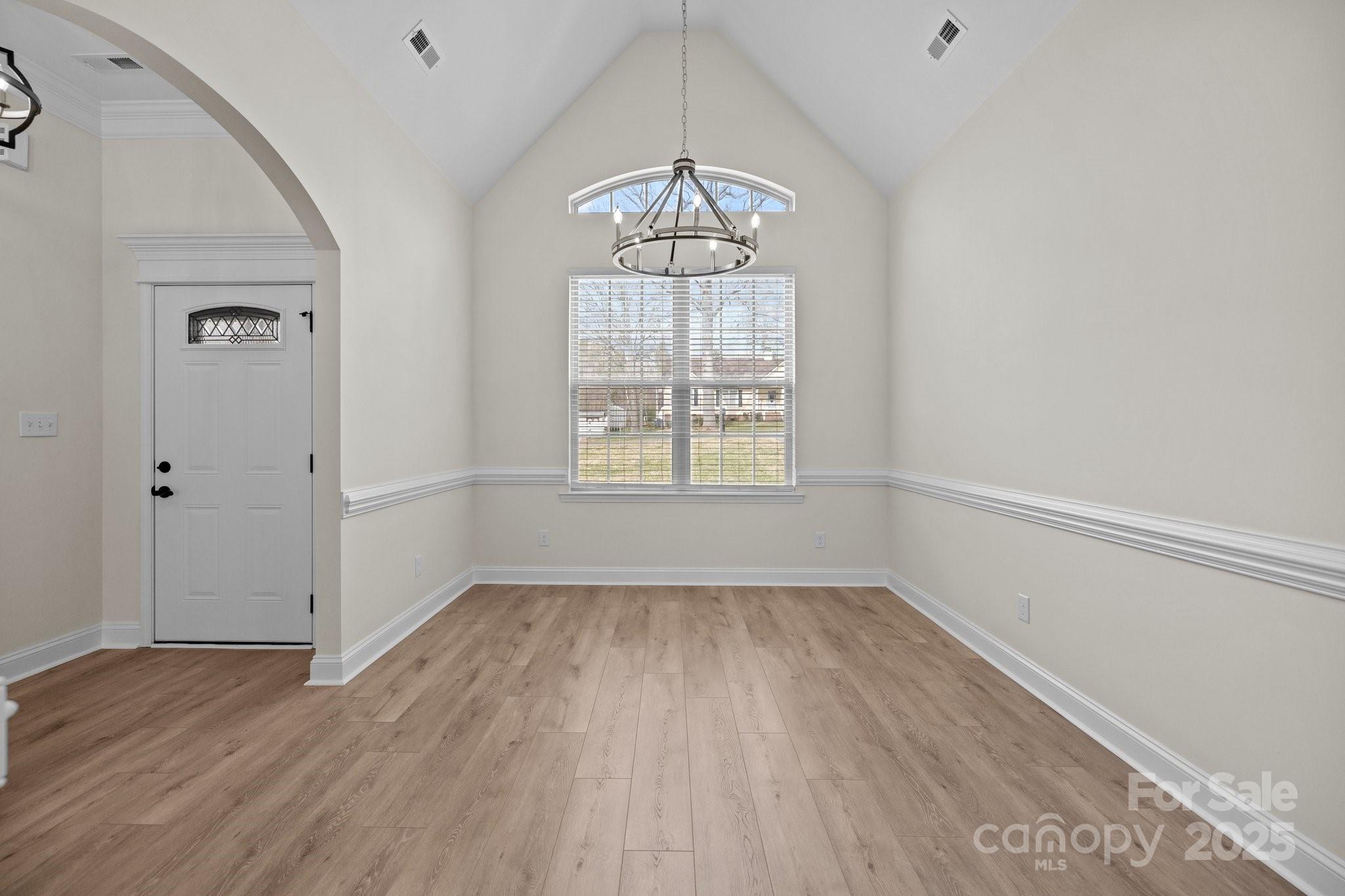 910 Pine Knoll Road, Unit 13 Fort Mill, SC 29715 - Photo 5 of 37 wooden floor in an empty room with a window