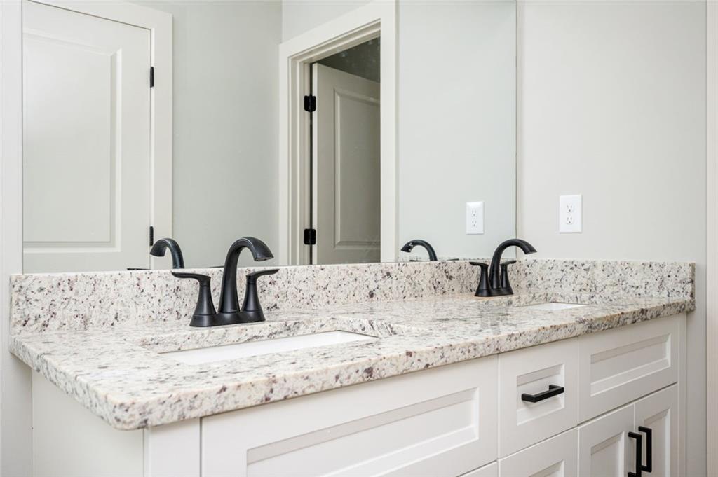 371 C W Sims Road Hiram, GA 30141 - Photo 8 of 12 a bathroom with sinks granite and a mirror