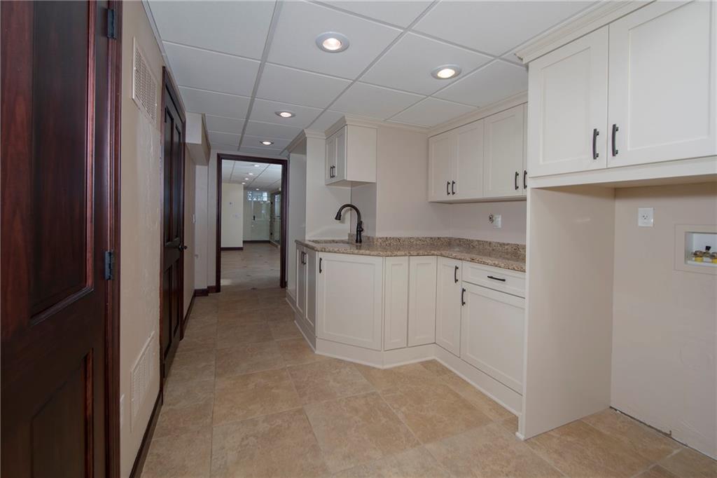 104 Woodridge Road Butler, PA 16001 - Photo 22 of 25 Laundry Room with Granite Counters