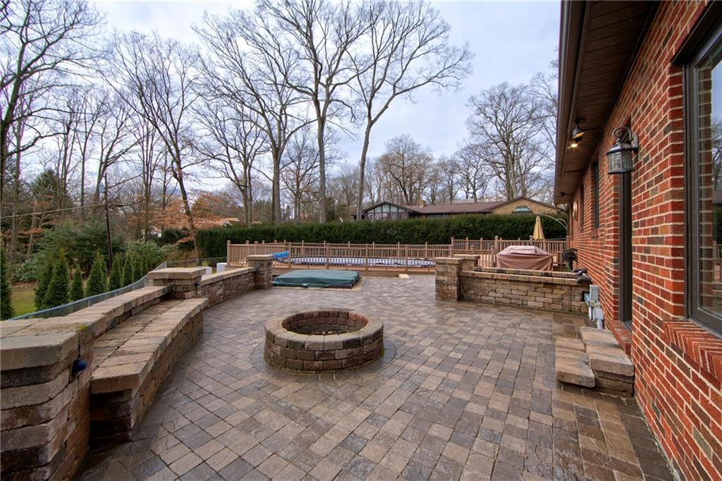 104 Woodridge Road Butler, PA 16001 - Photo 6 of 25 Stone Patio with built in seating and fire pit.