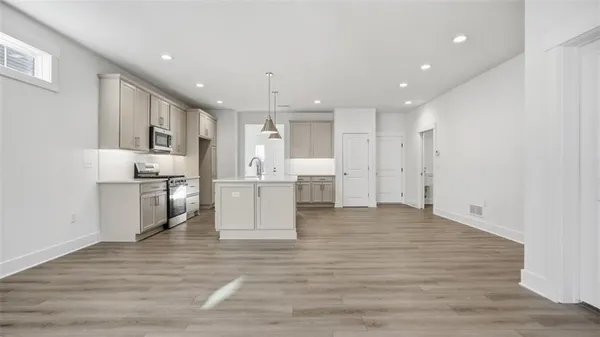 a view of kitchen with wooden floor