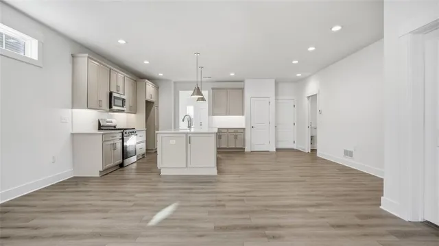 a view of kitchen with wooden floor