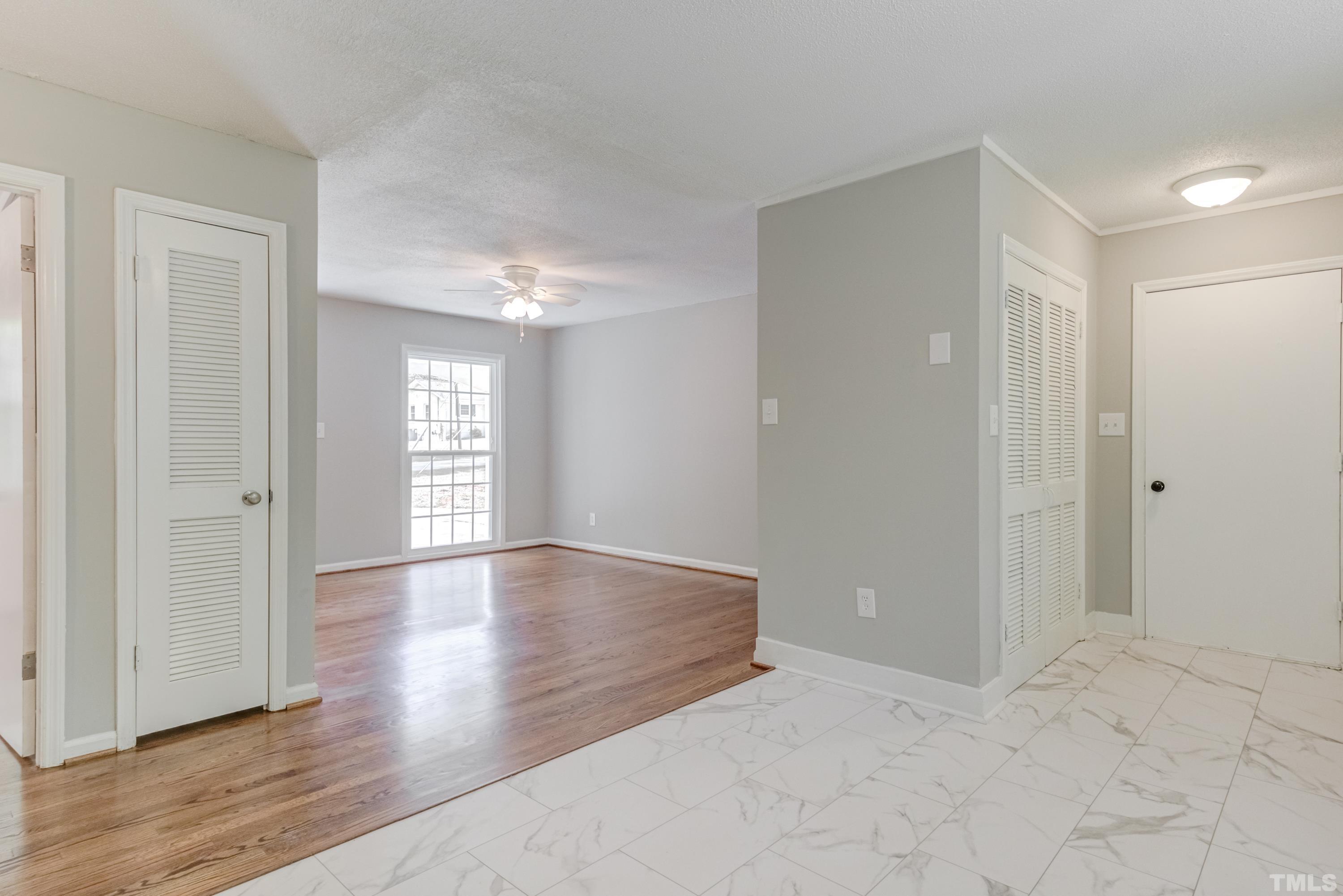 6005 Meadowbrook Road Raleigh, NC 27603 - Photo 14 of 42 a view of an empty room with wooden floor and a window