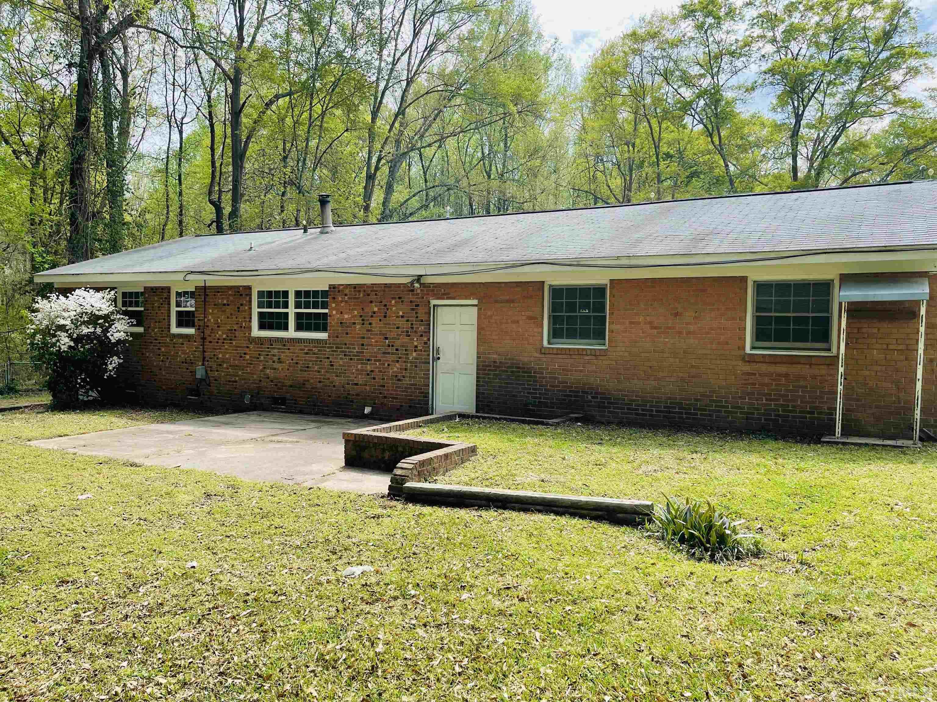 6005 Meadowbrook Road Raleigh, NC 27603 - Photo 2 of 42 front view of a house with a yard