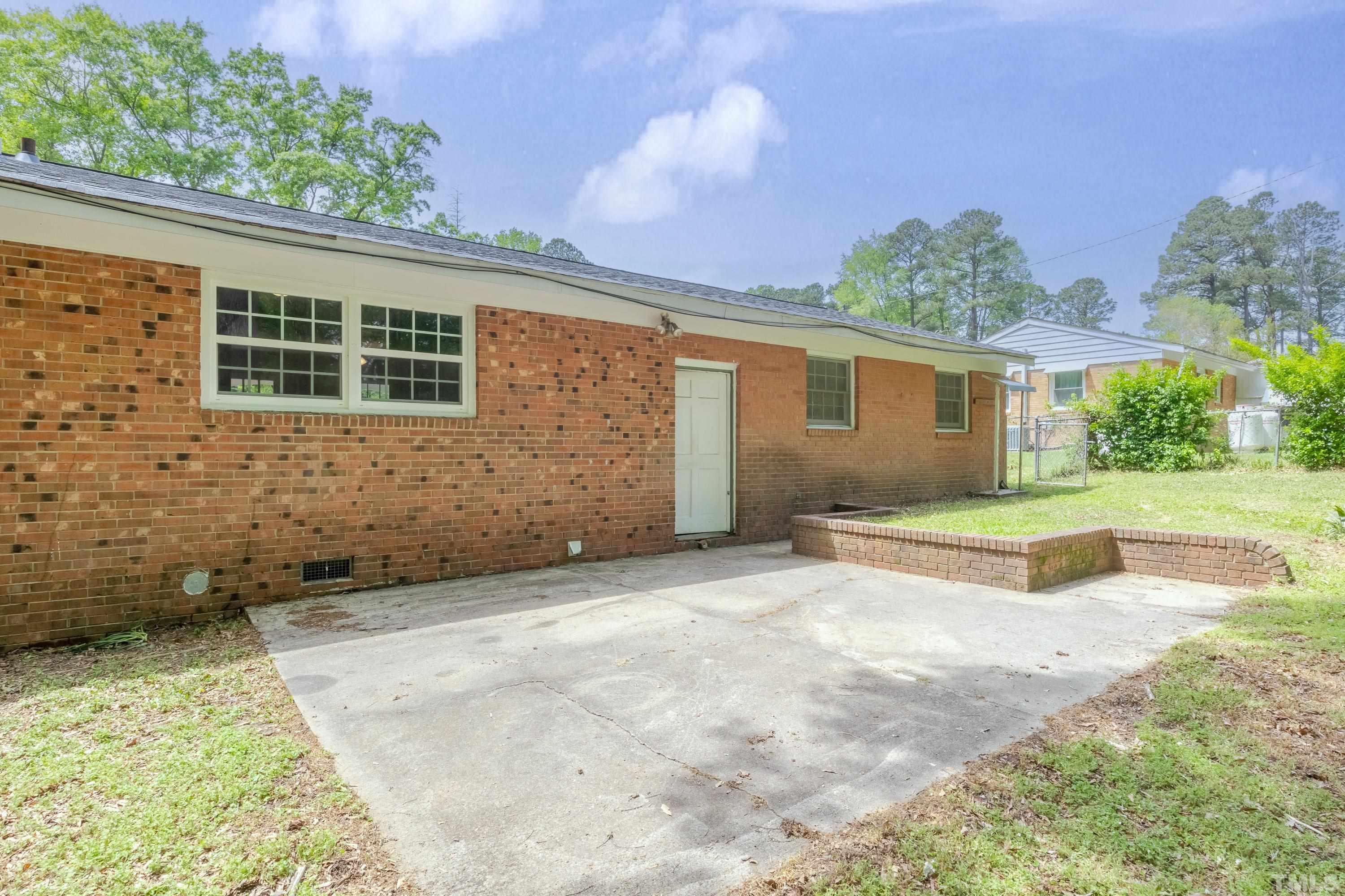 6005 Meadowbrook Road Raleigh, NC 27603 - Photo 25 of 42 front view of a house with a yard