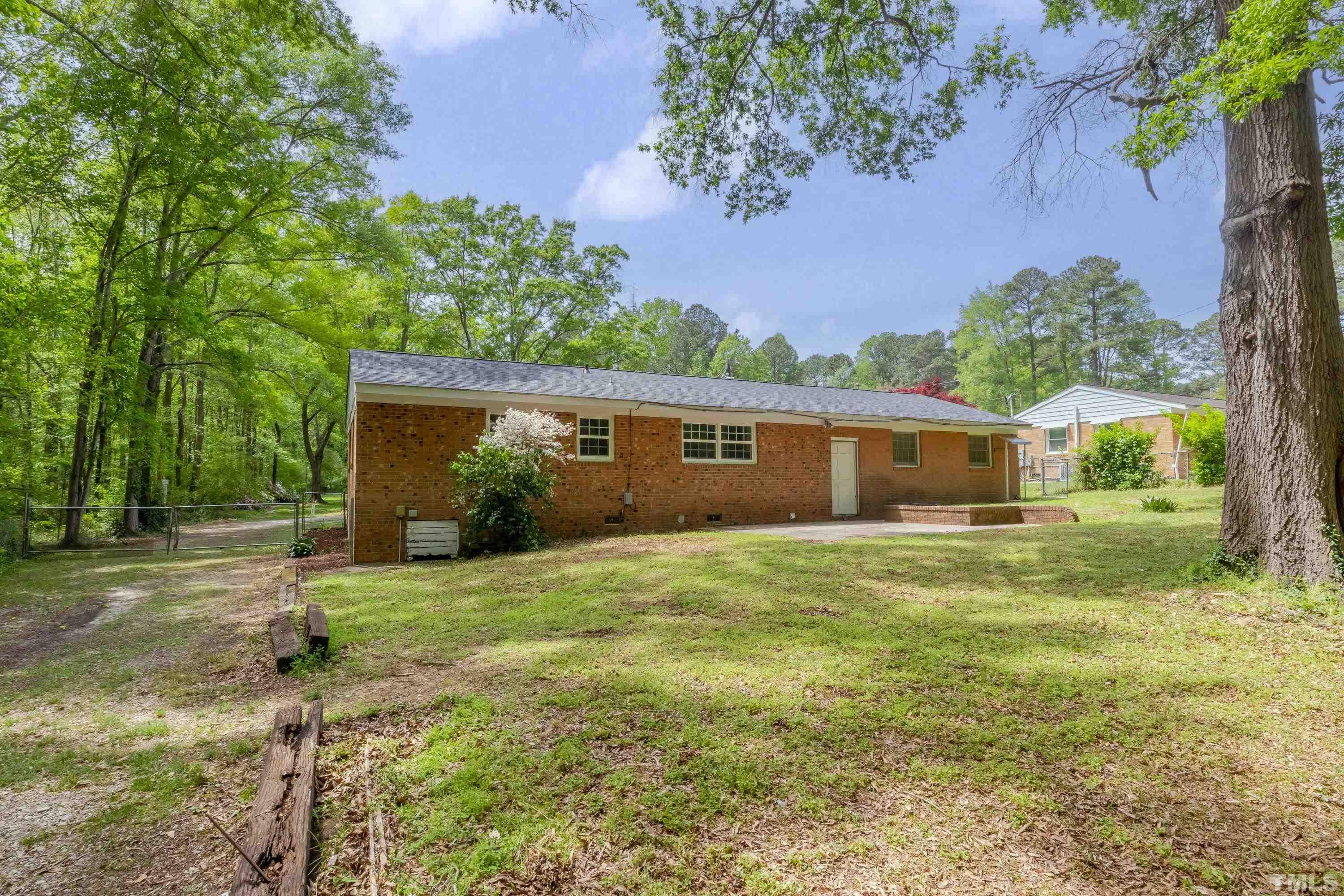 6005 Meadowbrook Road Raleigh, NC 27603 - Photo 27 of 42 a view of a house with a yard