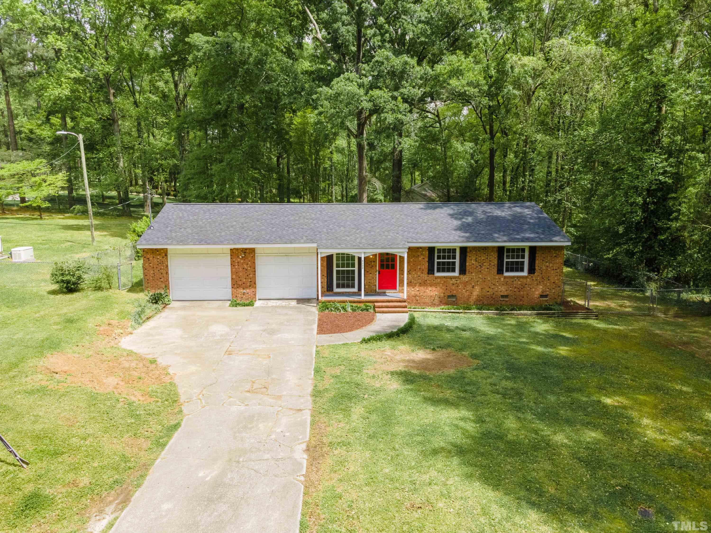 6005 Meadowbrook Road Raleigh, NC 27603 - Photo 33 of 42 front view of a house with a yard