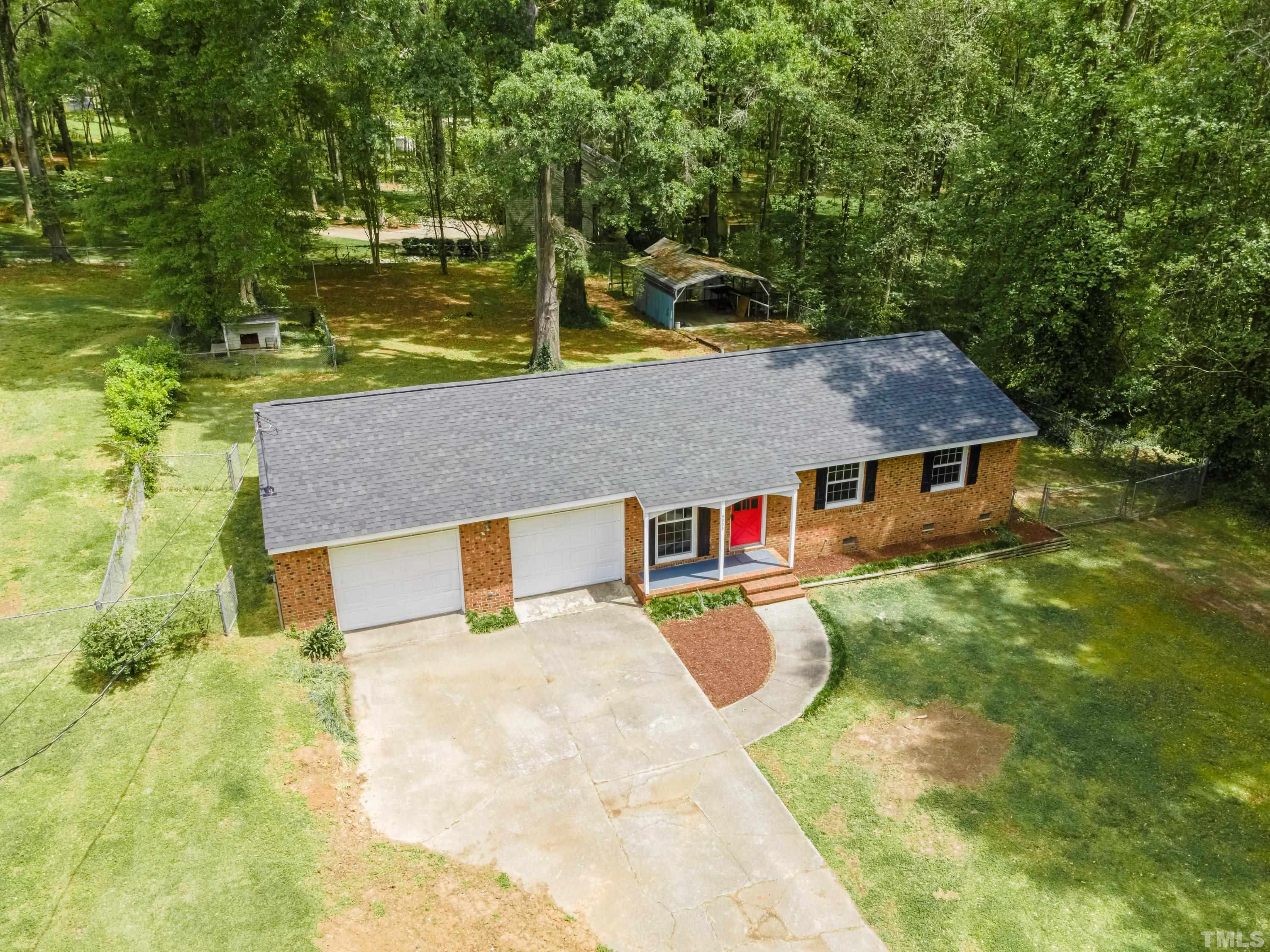 6005 Meadowbrook Road Raleigh, NC 27603 - Photo 34 of 42 view of a house with a yard
