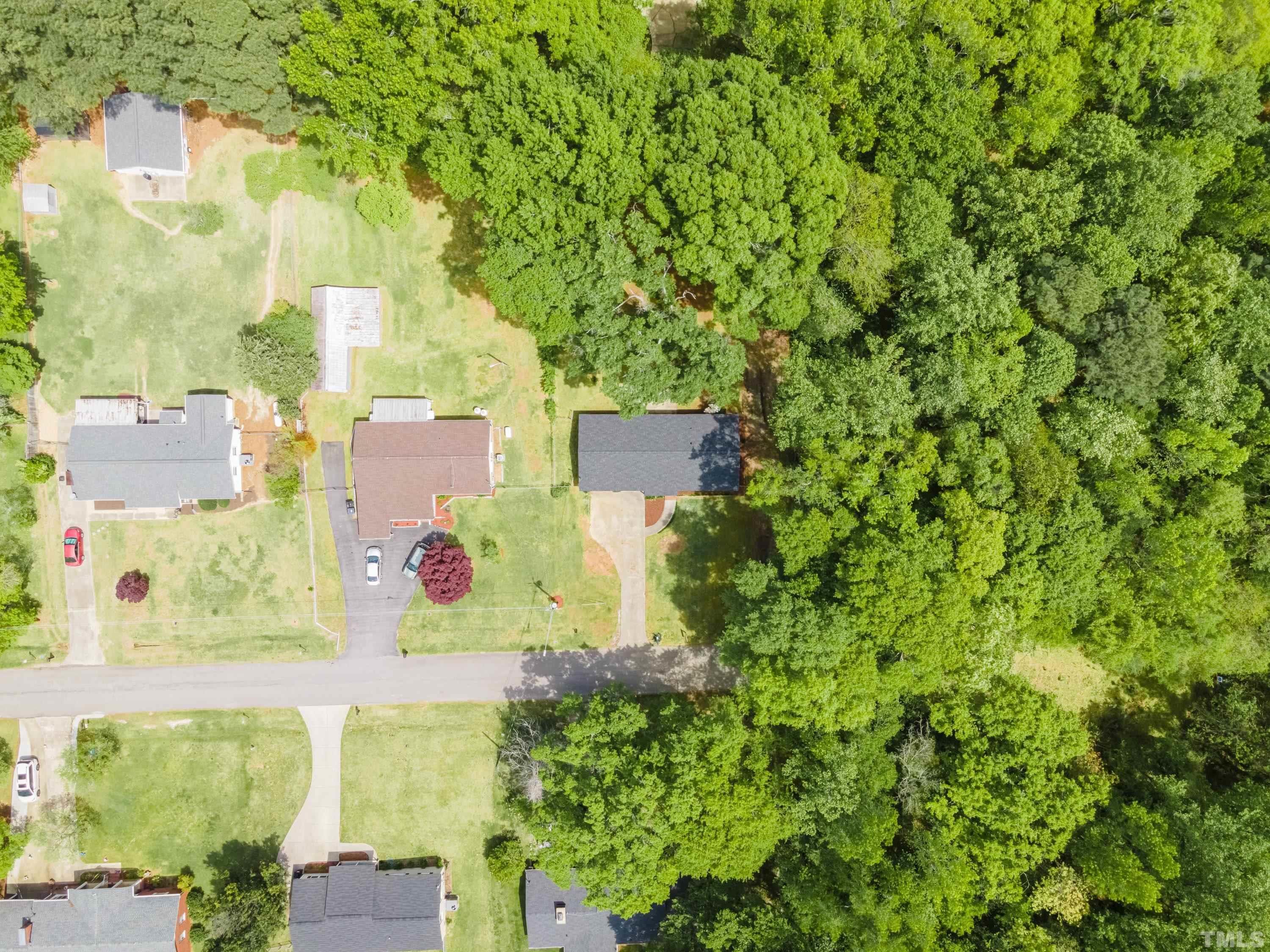 6005 Meadowbrook Road Raleigh, NC 27603 - Photo 36 of 42 an aerial view of residential house with outdoor space and trees all around
