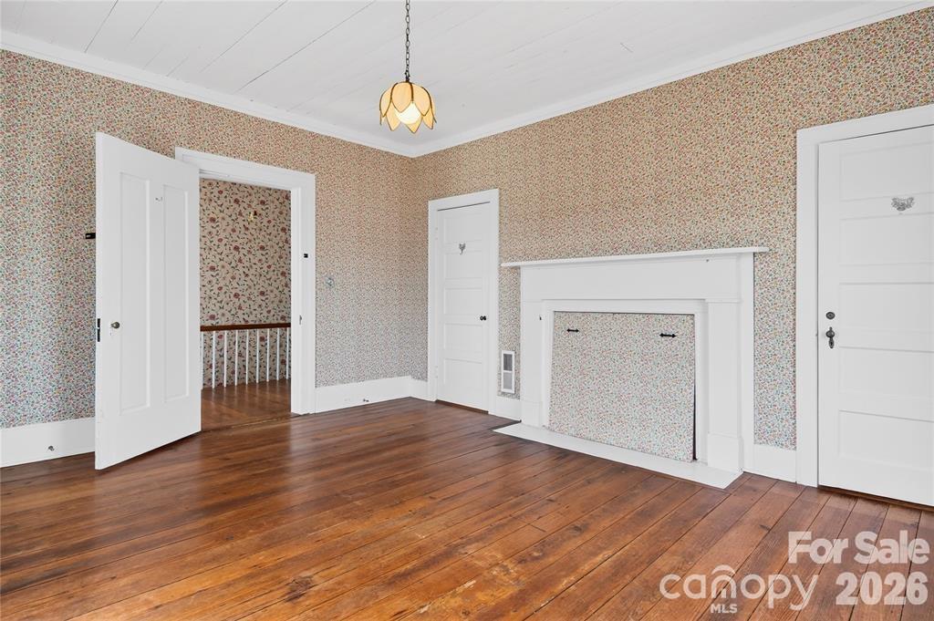 11124 Eastfield Road Huntersville, NC 28078 - Photo 25 of 41 an empty room with wooden floor and windows