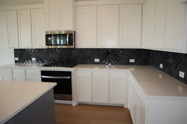 a kitchen with a sink and cabinets
