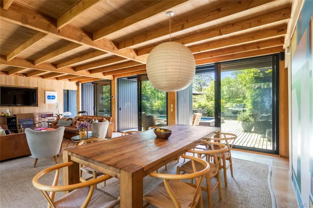 a view of a dining room with furniture window and outside view