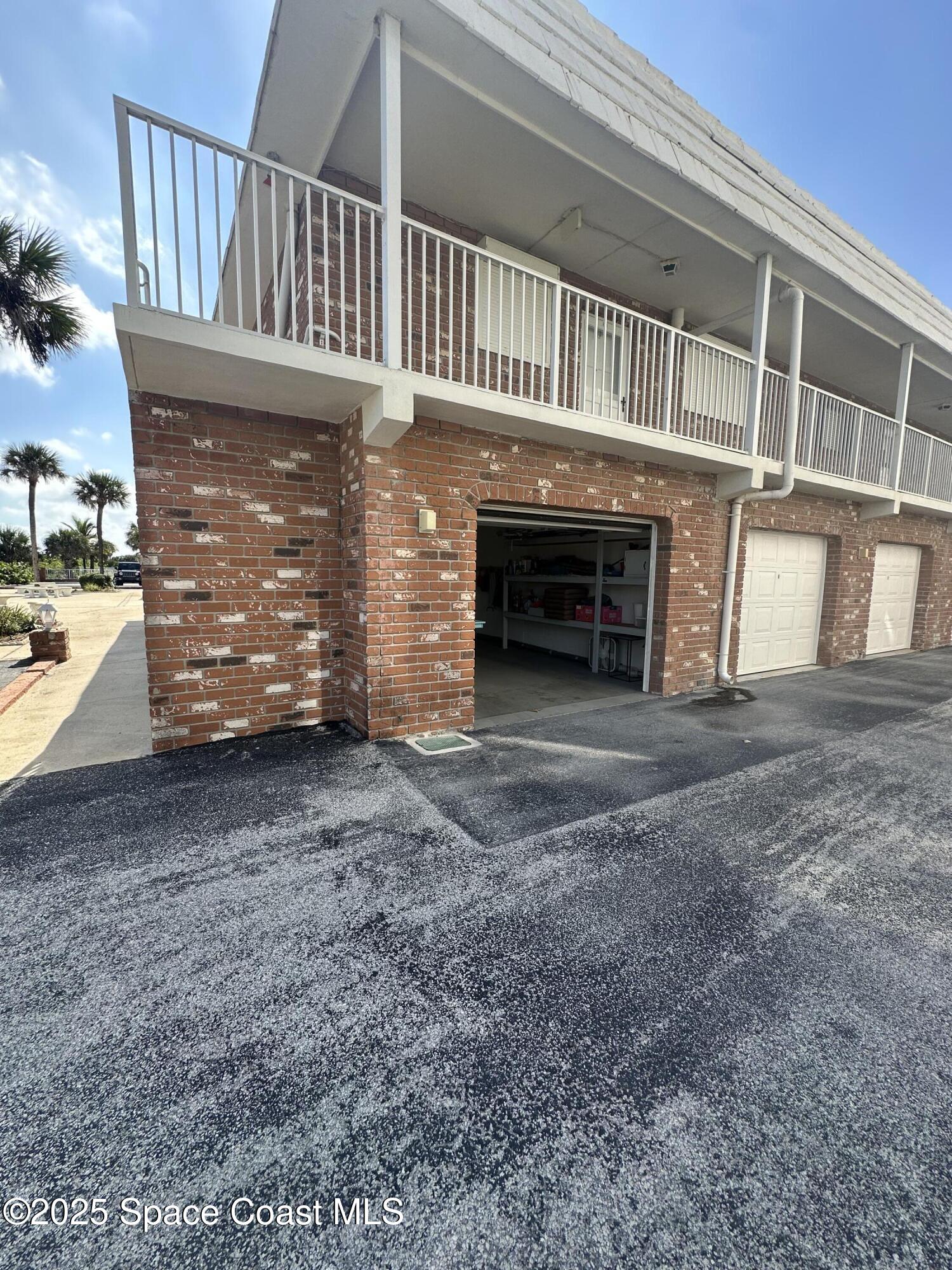 5000 Ocean Beach Boulevard, Unit C5 Cocoa Beach, FL 32931 - Photo 20 of 31 a view of a house with a yard