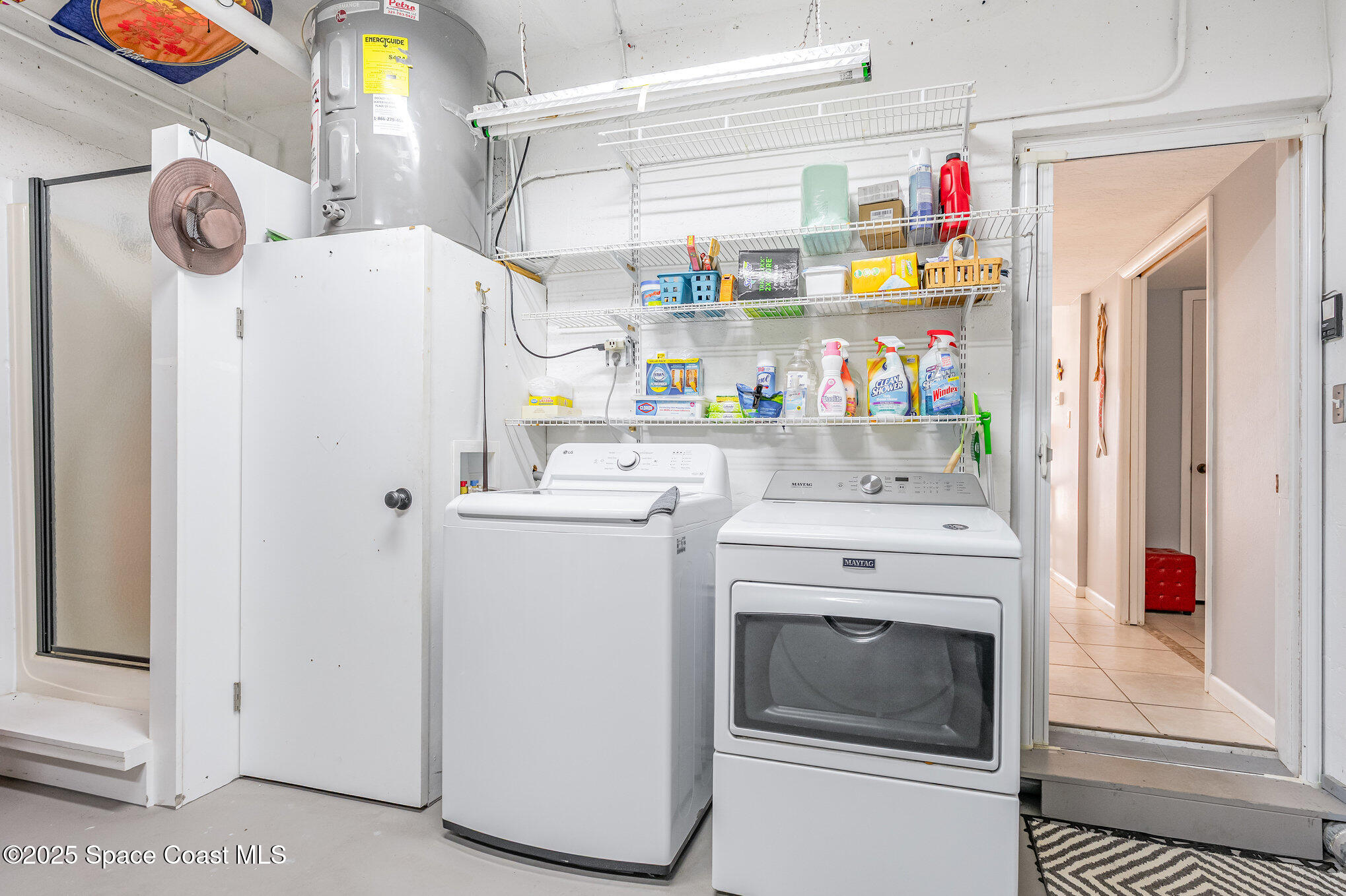 5000 Ocean Beach Boulevard, Unit C5 Cocoa Beach, FL 32931 - Photo 22 of 31 a utility room with dryer and washer
