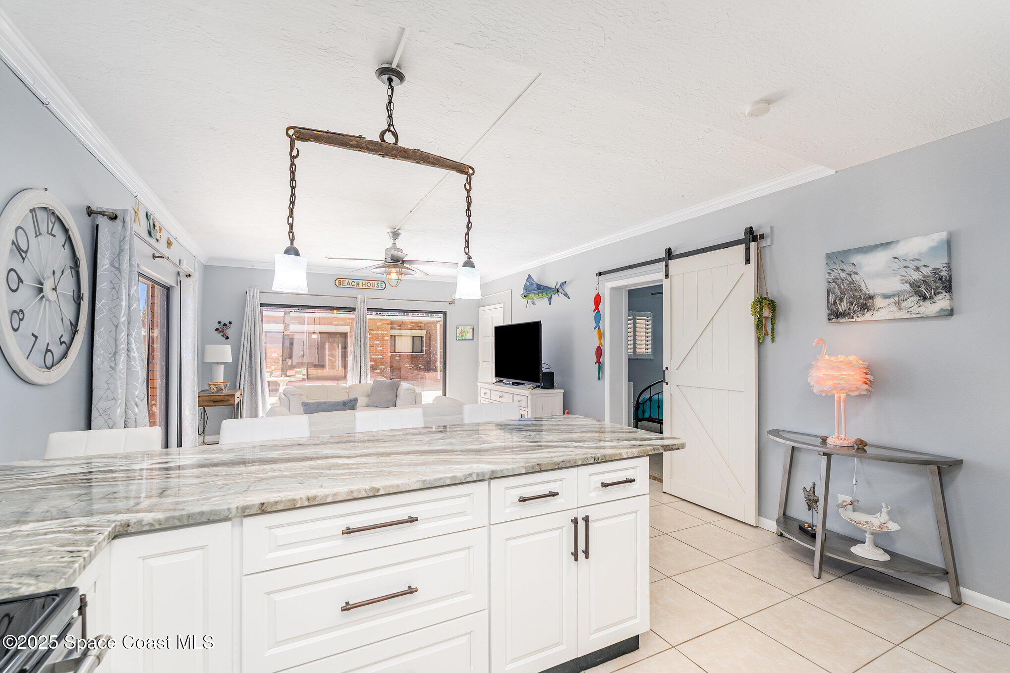 5000 Ocean Beach Boulevard, Unit C5 Cocoa Beach, FL 32931 - Photo 5 of 31 a bathroom with a granite countertop sink and a mirror
