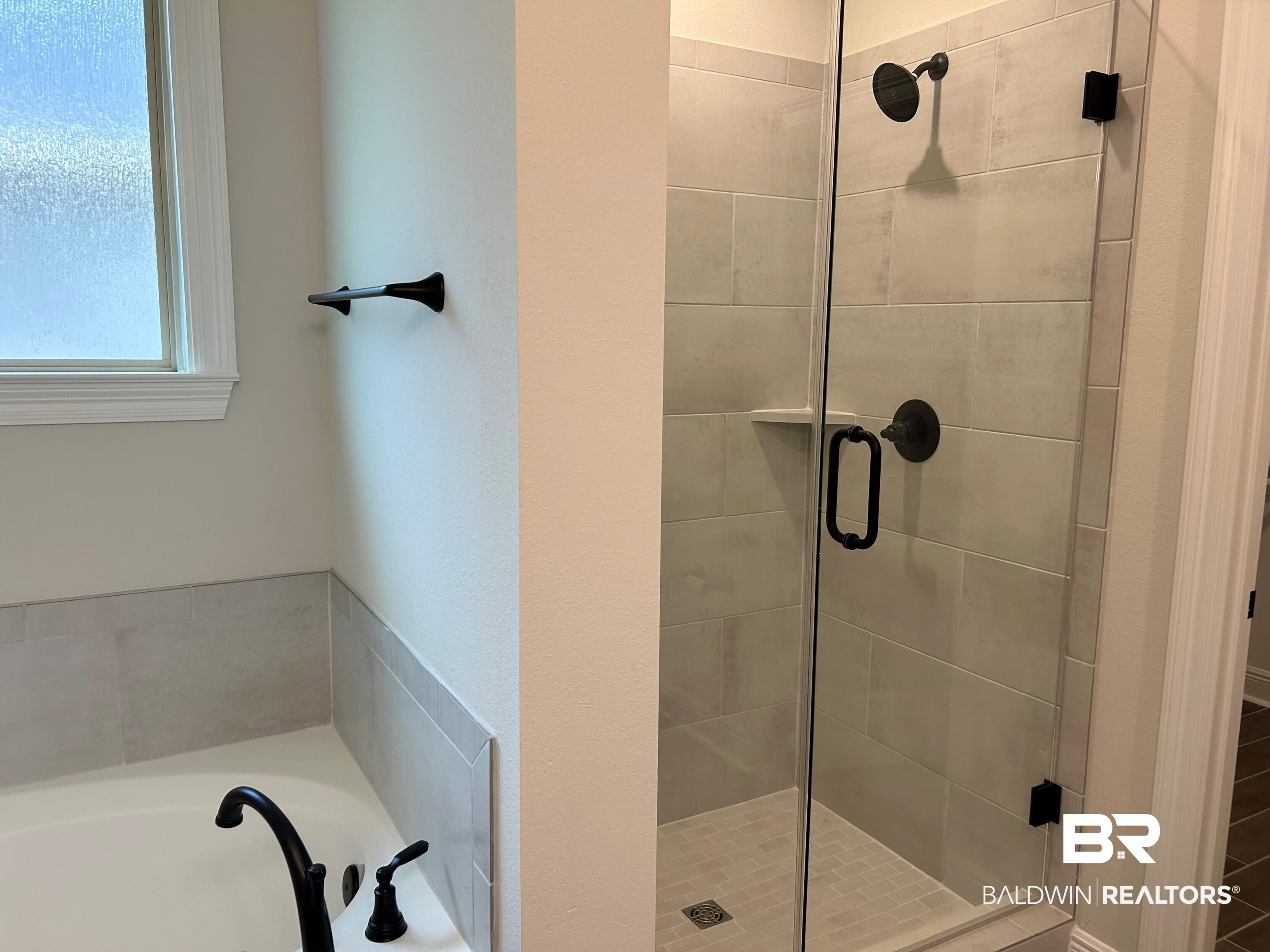 844 Sumter Loop Foley, AL 36535 - Photo 10 of 18 Bathroom with shower with separate bathtub