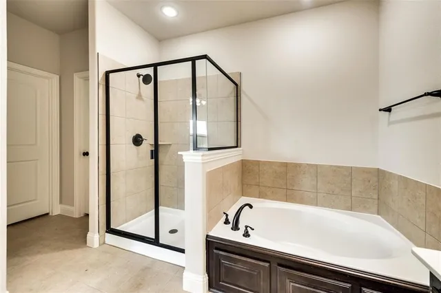 a bathroom with a sink vanity and mirror