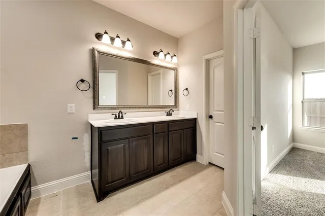 a view of a backyard with plants and a garden