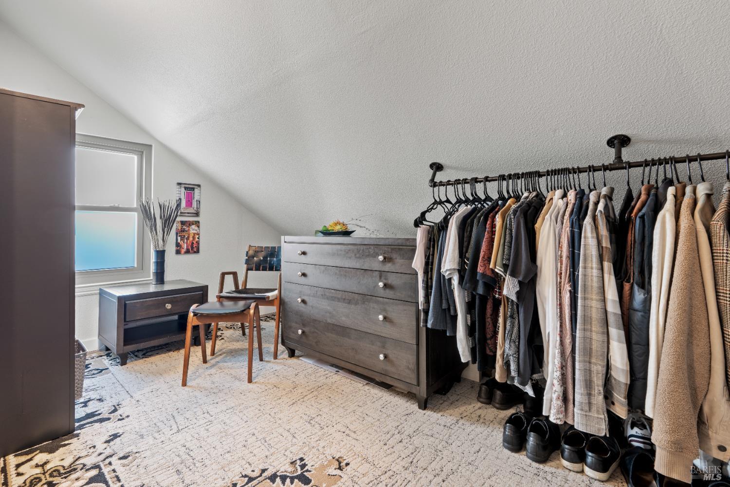 8633 Lancaster Drive Rohnert Park, CA 94928 - Photo 13 of 66 a view of walk in closet with clothes and shoes