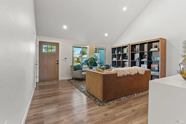 a bedroom with a bed and a potted plant