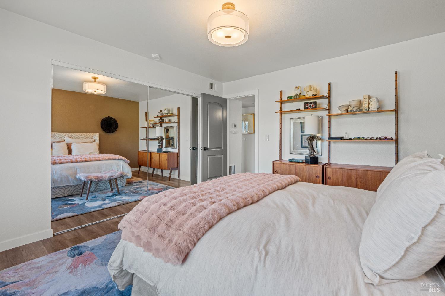 8633 Lancaster Drive Rohnert Park, CA 94928 - Photo 30 of 66 a bedroom with a large bed and a chandelier