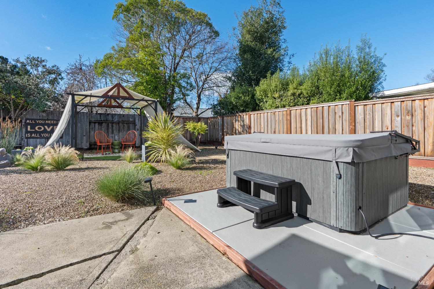8633 Lancaster Drive Rohnert Park, CA 94928 - Photo 41 of 66 a view of a small house in the middle of a yard