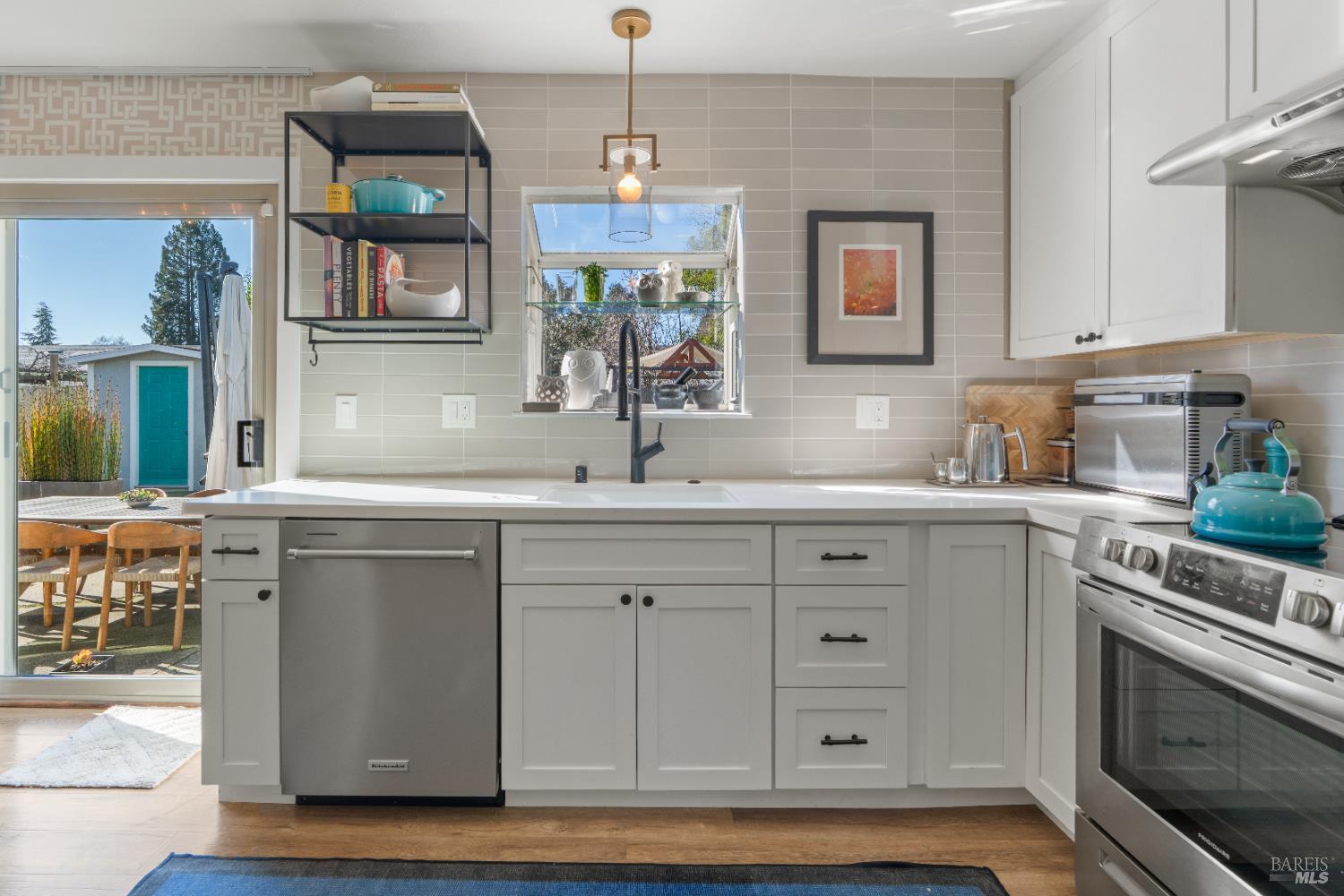 8633 Lancaster Drive Rohnert Park, CA 94928 - Photo 6 of 66 a kitchen with cabinets appliances and a window