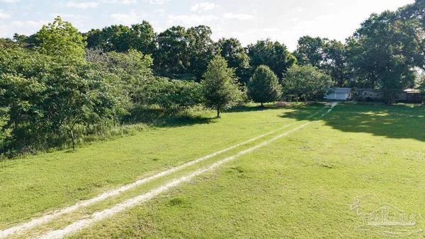 a view of a lake with a yard