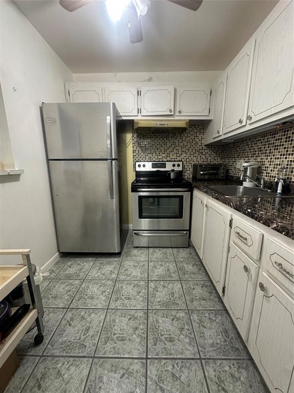 84 Farnham East, Unit 84 Deerfield Beach, FL 33442 - Photo 11 of 57 a kitchen with stainless steel appliances granite countertop a refrigerator sink and cabinets
