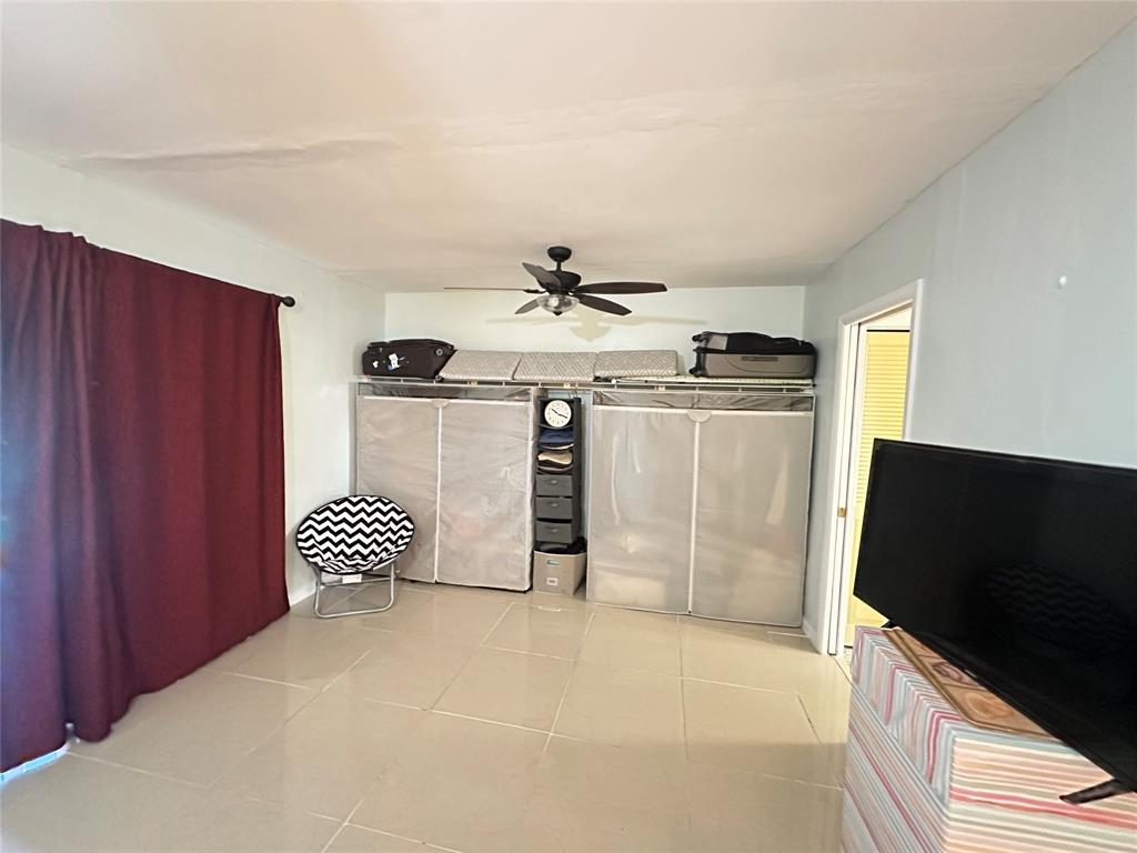 84 Farnham East, Unit 84 Deerfield Beach, FL 33442 - Photo 14 of 57 a kitchen with stainless steel appliances kitchen island granite countertop a refrigerator and stove