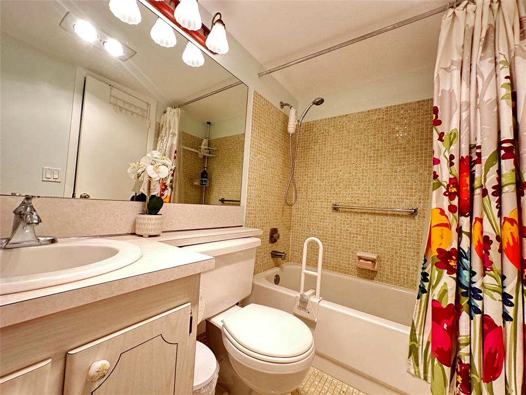 84 Farnham East, Unit 84 Deerfield Beach, FL 33442 - Photo 18 of 57 a bathroom with a sink a toilet and shower