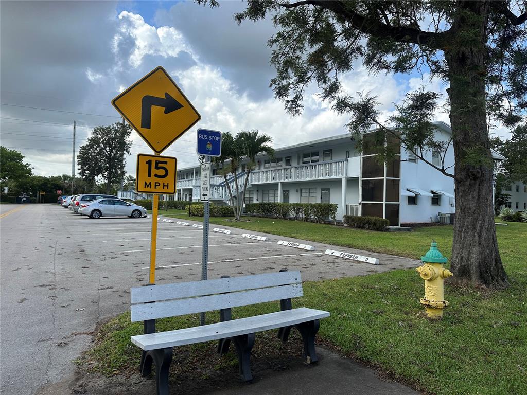 84 Farnham East, Unit 84 Deerfield Beach, FL 33442 - Photo 23 of 57 a sign board with a yard