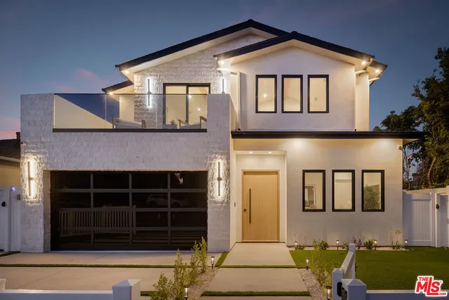 a living room with couches and a large window with outer view