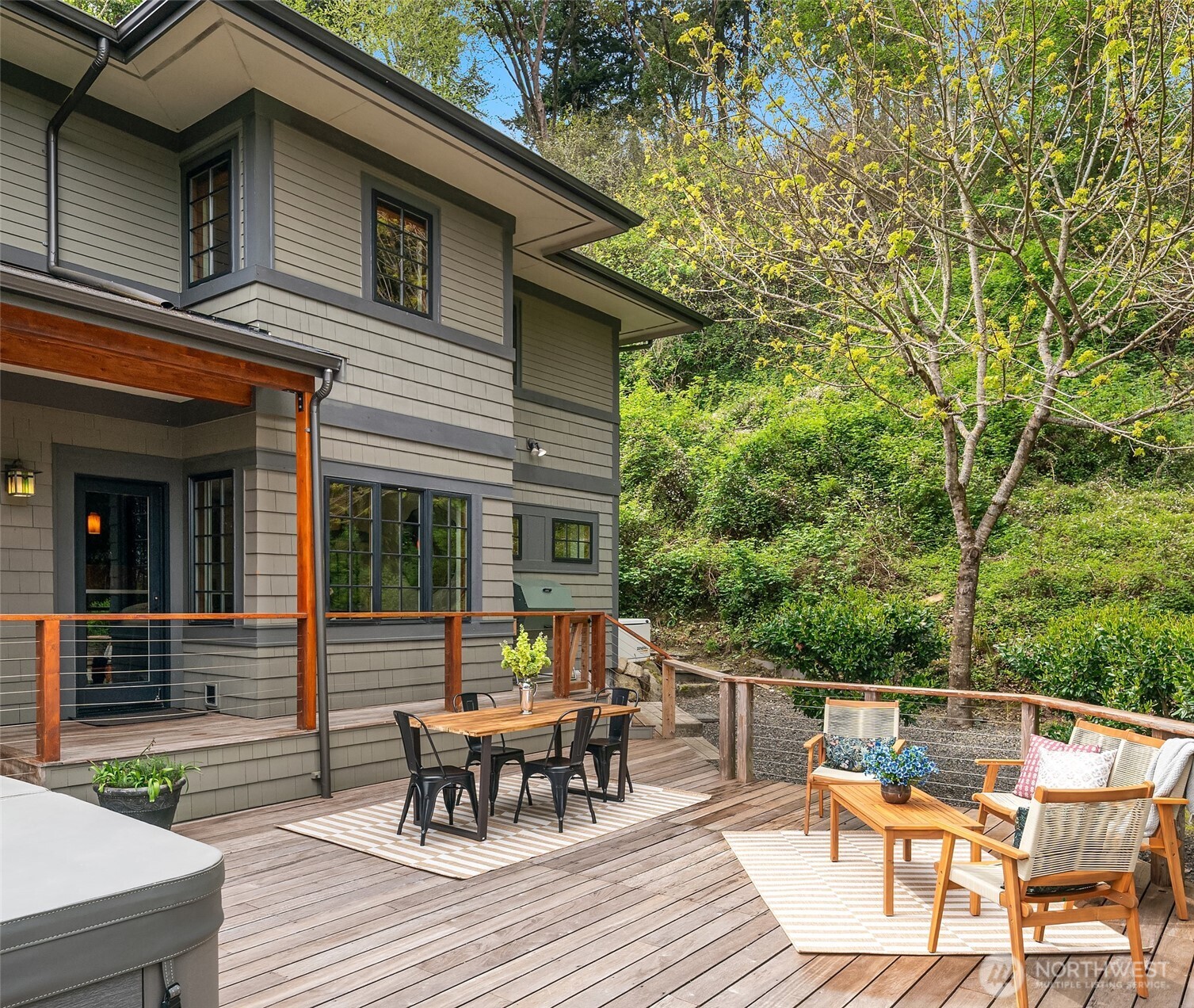 8302 Southwest Dilworth Road Vashon, WA 98070 - Photo 30 of 40 a view of a patio with table and chairs and wooden floor