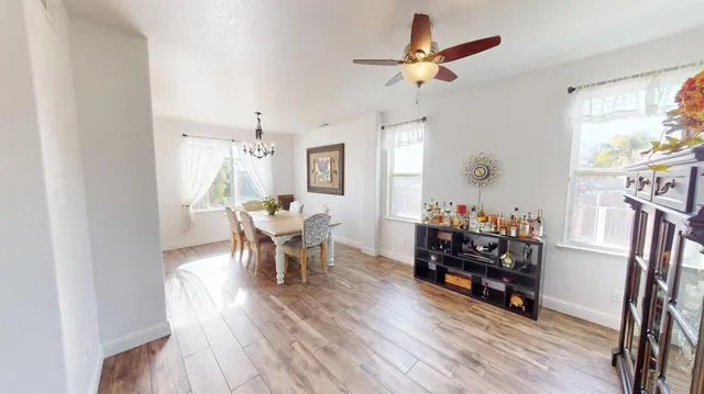a living room with furniture a fireplace and a window