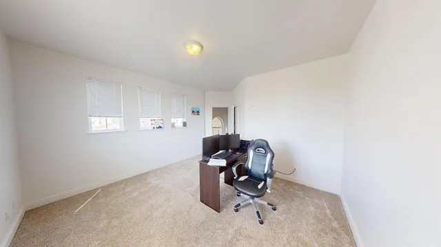 a bedroom with a bed and cabinets