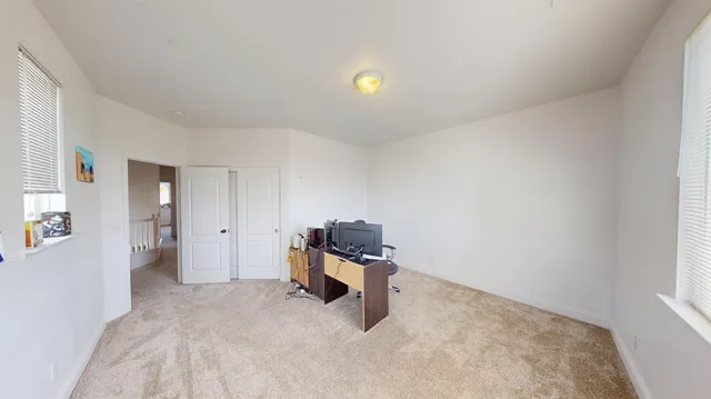 a living room with granite countertop furniture and a ceiling fan