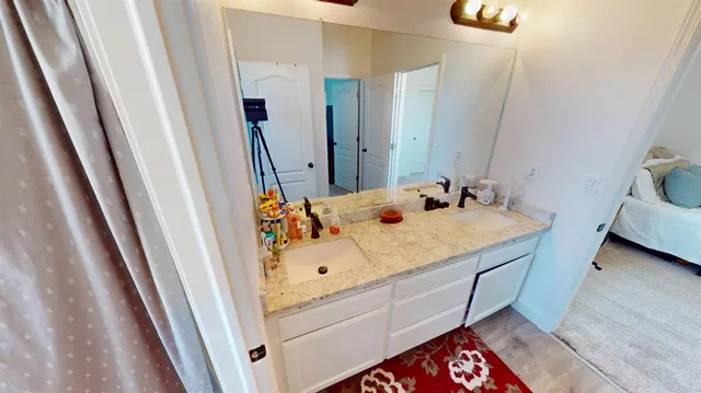 a bedroom with a bed and a couch