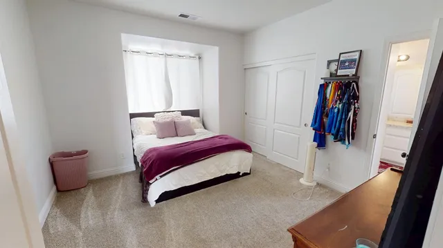 a view of a backyard with wooden fence