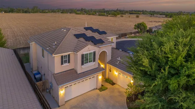 a aerial view of a house with a lake view