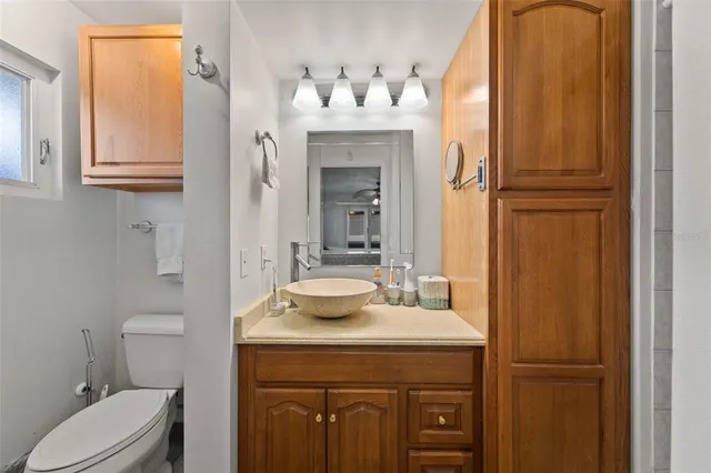 a bathroom with a sink vanity and a mirror