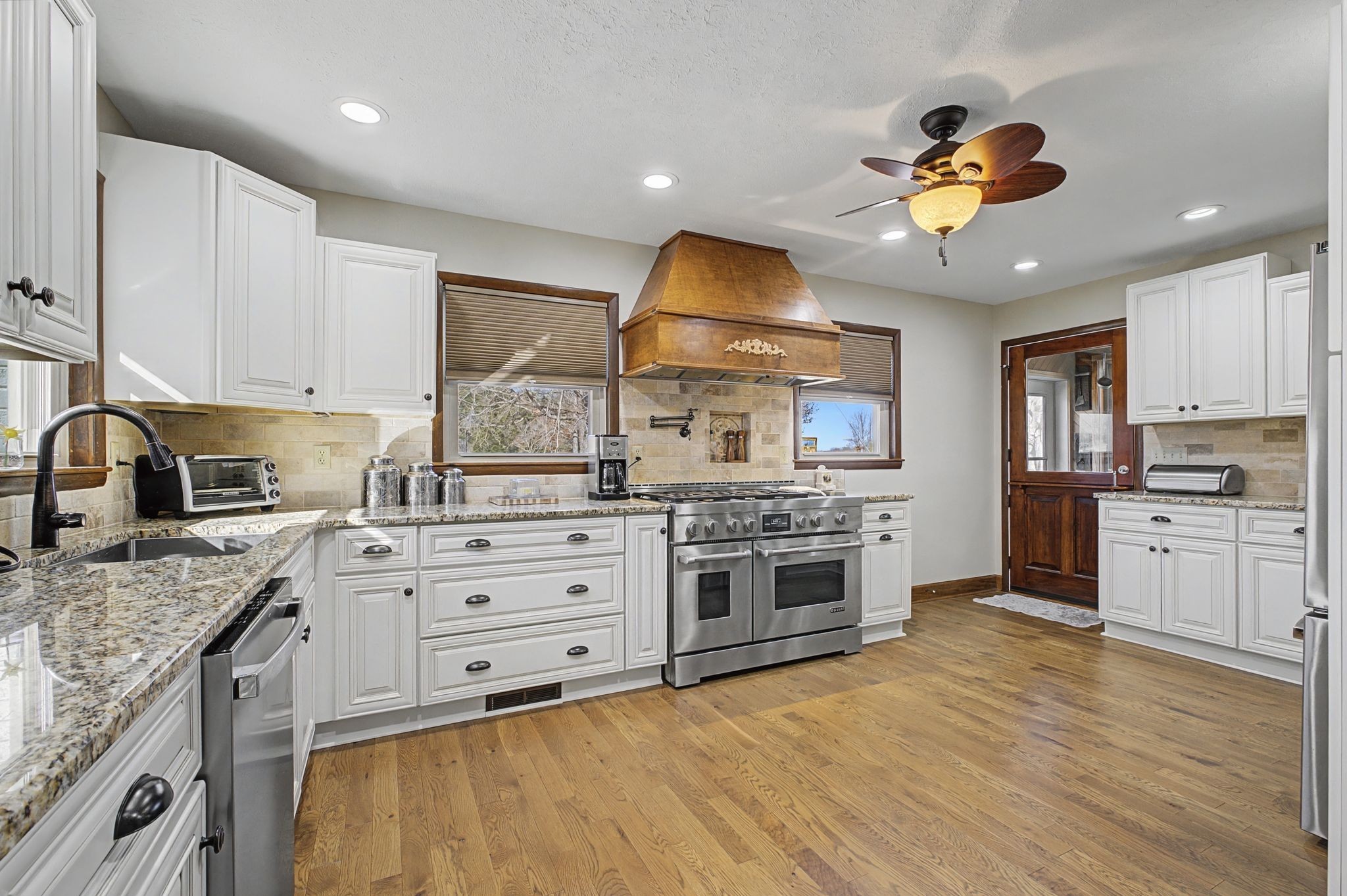 1231 Abiff Road Bon Aqua, TN 37025 - Photo 12 of 60 a kitchen with stainless steel appliances granite countertop a stove and a sink