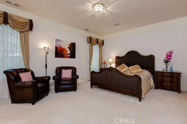 a bedroom with furniture and a bed